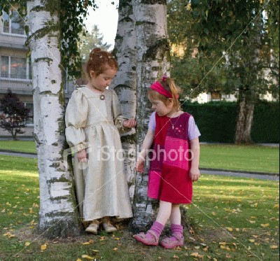 ist2_950943_two_girls_in_contrasting_modern_and_old_fasioned_clothes.jpg